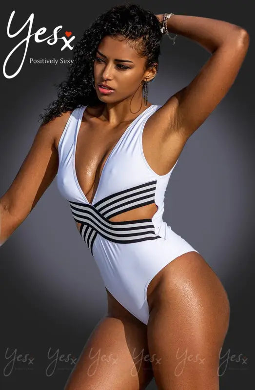 Timeless Sexy White Swimsuit with Striking Black Design and Cutouts
