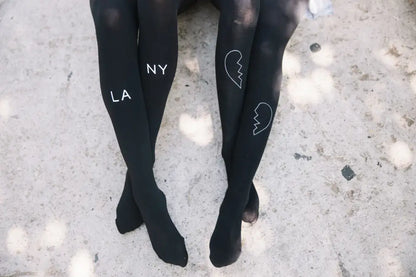 Experience Luxury with Zohara East West Black Tights in Light Grey Print